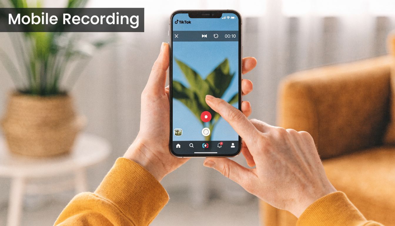 A person holding a smartphone and using the TikTok mobile app to record a video.